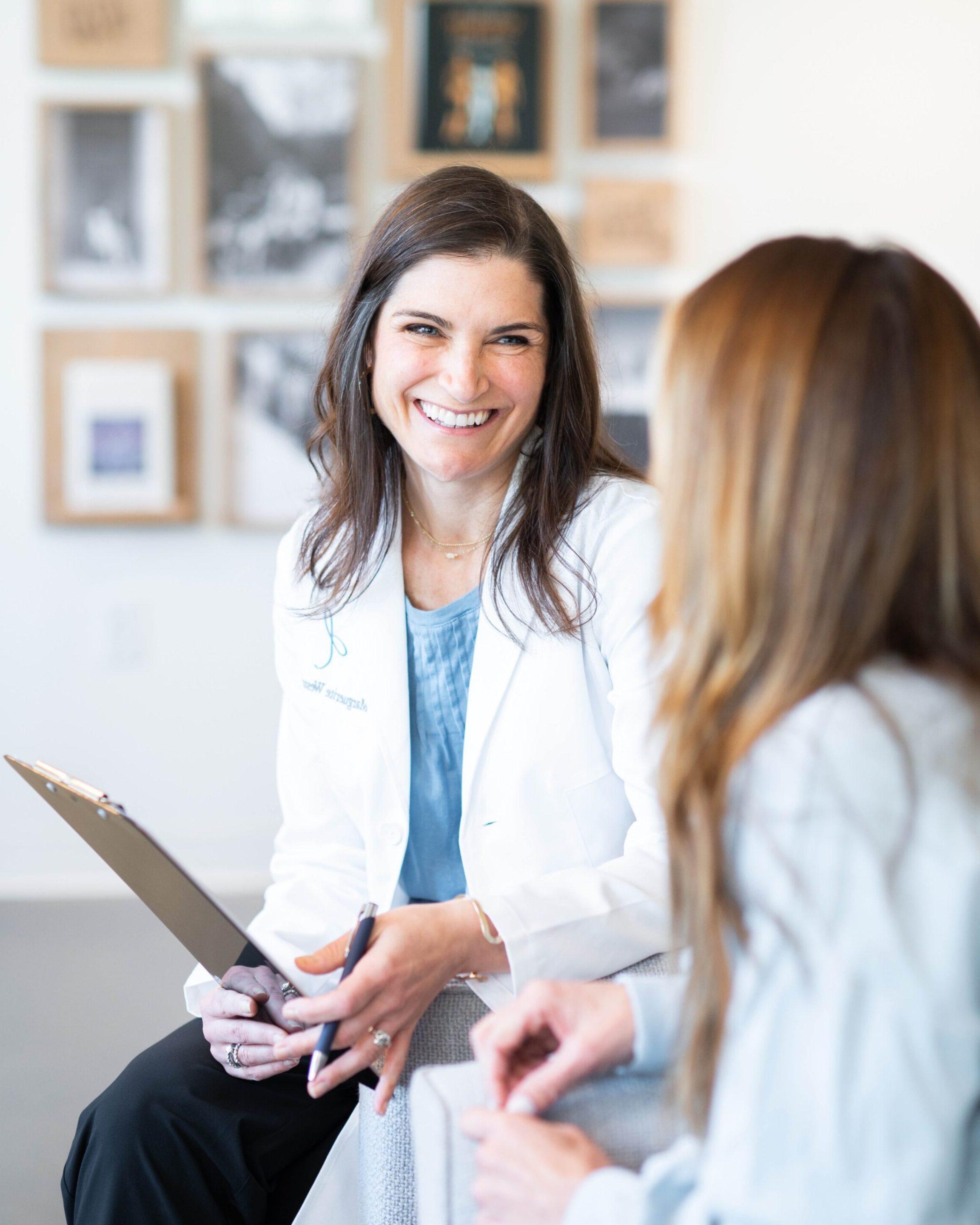 Dr. Weston discussing test results with a patient in the office